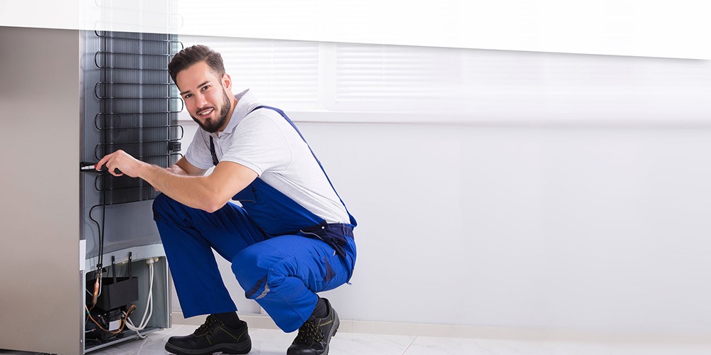 Fix Masters technician performing appliance repair in Pompano Beach